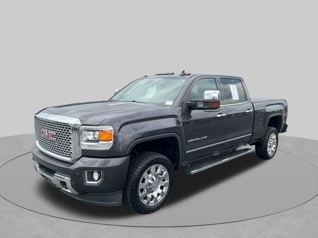 2016 GMC Sierra 2500HD Denali in Iridium Metallic — front three-quarter view
