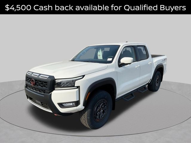 2026 Nissan Frontier PRO-4X in Glacier White — front three-quarter view